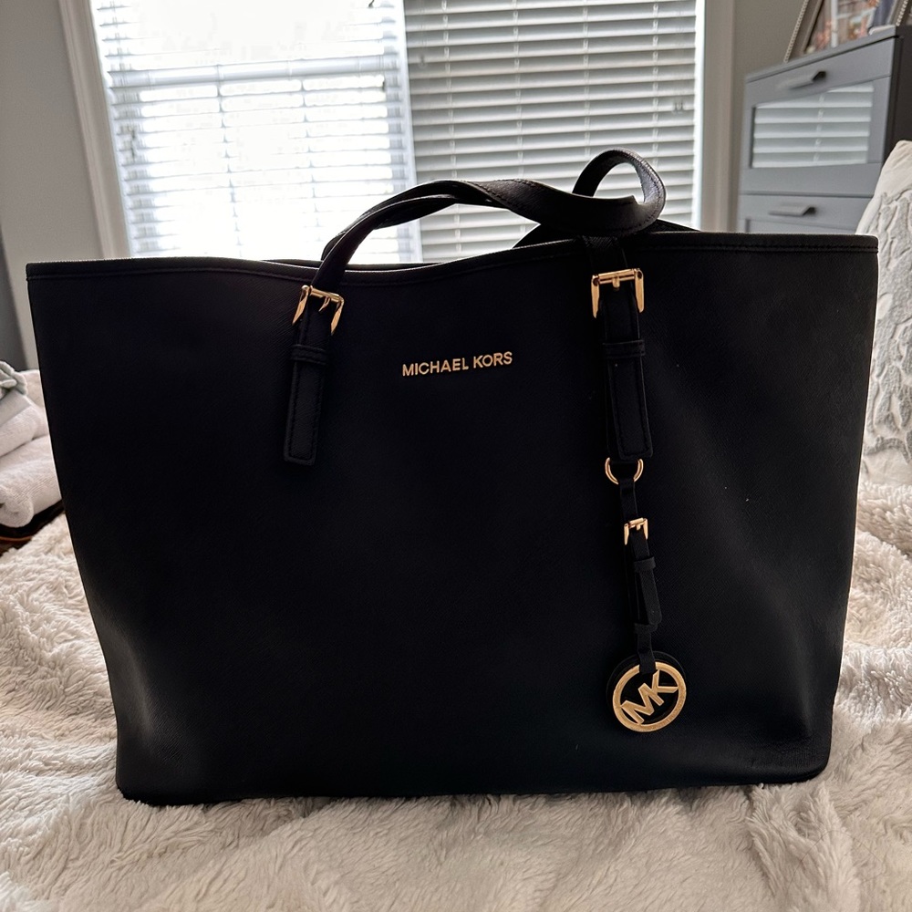 Black leather Michael Kors bag with gold accents